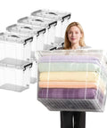 Sleek Clear Plastic Storage Bins With Secure Lids 90 Quarts 8 Pack, a person carrying a large bin filled with blankets.