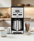 Personal Brew 10 Cup Thermal Coffee Maker Fully Automatic Programmable With No Fuss Hot Or Over Ice Options Brew Strength Control And 52 Ounce Removable Water Reservoir DCC 10 on kitchen counter with cups of coffee.