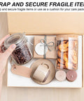 Box with glass jars, a ceramic mug, wood coasters, and a gift box for wrapping with white kraft paper roll 15 inch wide by 354 inch long industrial grade recyclable 80gsm heavy duty easel paper for arts and crafts big roll gift wrapping moving wall art and kids projects