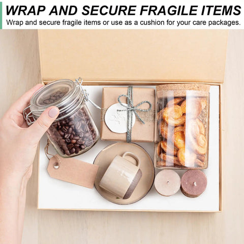 Box with glass jars, a ceramic mug, wood coasters, and a gift box for wrapping with white kraft paper roll 15 inch wide by 354 inch long industrial grade recyclable 80gsm heavy duty easel paper for arts and crafts big roll gift wrapping moving wall art and kids projects