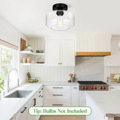 Industrial Dope Semi Flush Mount Ceiling Light In Matte Black With Clear Glass Shade in modern farmhouse kitchen setting.