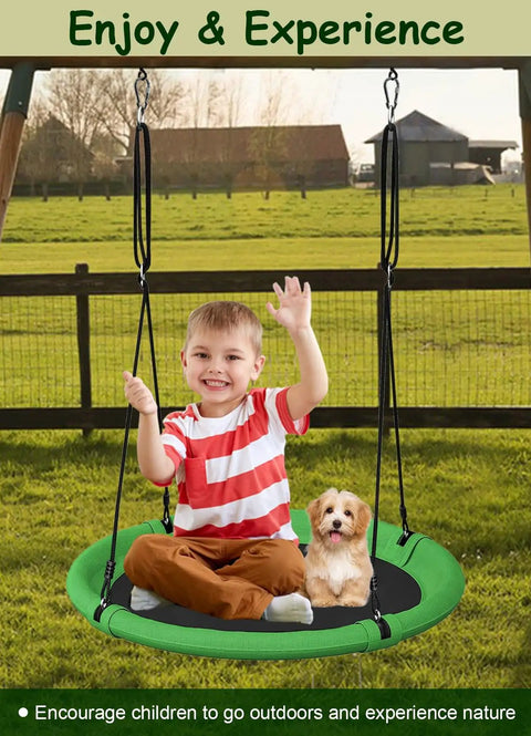 Child and dog sitting on 24 Inch Saucer Tree Swing Set For Kids And Adults, Adjustable Backyard Or Outdoor Playground Swing, Green And Black
