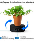 6 Piece Black Turner Cup Rotating Display Stand With USB Power Cable And Silent Motor Battery Backup For Kitchen Tumbler Organization displaying plant.