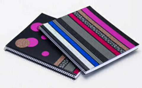 Two spiral notebooks with decorative covers in black and colorful washi tape design, showcasing creative uses for Black Stripe Washi Craft Tape.