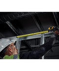 Worker using Tough Series 25 Ft Tape Measure With Magnetic Clip And Double Sided Blade Pro Grade Heavy Duty Housing Extend Reach