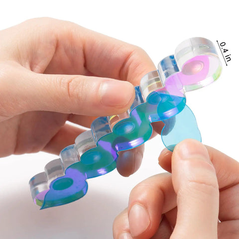 Hands holding Pro Grade Magnetic Nail Stand For Press Ons With Thick Base And Taller Pegs Anti Tip Acrylic Nail Holder