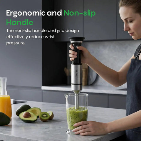 Hella Smooth Immersion Hand Blender With Variable Speed Trigger blends green smoothie in glass, showcasing ergonomic non-slip handle.