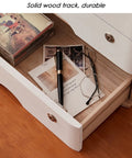 Open drawer of solid wood desk organizer with lockable drawers for home office storage and file organization, showing contents