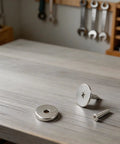 Ultra Slim Magnetic Cabinet Door Catch With 15 LB Holding Power, Heavy Duty Metal Latch, silver, with screws on table
