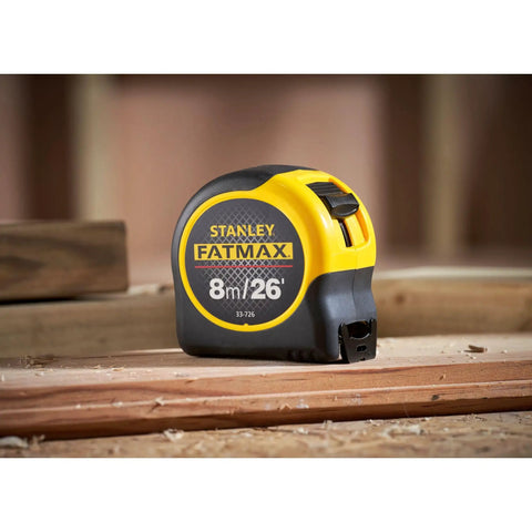 Fatmax Tape Measure With Blade Armor And Dual Scale 8m Length on wooden surface in workshop