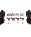 Top-down view of TRW brake pad set TRH0273 with four pads and hardware, black backing plates with red TRW logo.