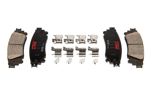 Top-down view of TRW brake pad set TRH0273 with four pads and hardware, black backing plates with red TRW logo.
