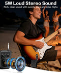 Man playing guitar by campfire using Pocket Sized 5W Mini Guitar Amp With Bluetooth And USB Playback Four Built In Effects