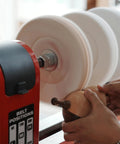 Woodworking Lathe Buffing System MT2 Mandrel 8 Inch Three Step Buffing Wheel Kit being used on wood piece