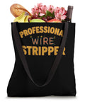 Kickass Electrician Tote Bag With Funny Professional Wire Stripper Print fresh with groceries and flowers in a black canvas bag.