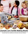 Electric Tortilla Maker Machine Non Stick Taco Press Two Inch Molds Adjustable Thickness Setting For Homemade Chapatti Roti Pita And Pizza Dough Kneading, shown in a busy kitchen with children.