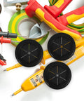 Black Rubber Grommet Kit For Cable Management With Dual Sided Buckle Design, Fire Resistant And Waterproof Desk Hole Cover For Office And Home Use, Includes Four Pieces. Three black rubber desk grommets with tools and cables on white background.