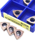 Heavy Duty Indexable Carbide Lathe Tool WCMT050308 For Steel And Stainless Steel Machining CNC Milling Cutting Inserts in blue box.