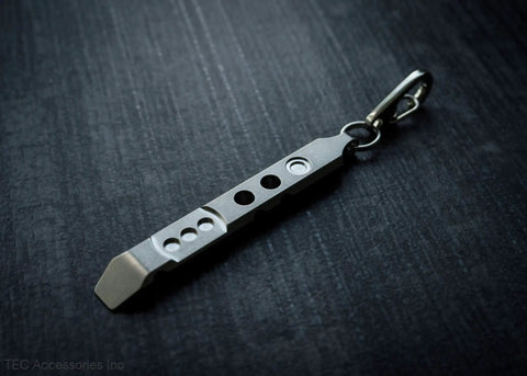 Titanium Ti Pry Mini Pry Bar Keychain EDC Pocket Pry Tool With Bottle Opener on dark background