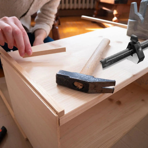 Dead On Precision Carpentry Scriber Mortise Marking Gauge on a wooden surface with a hammer for woodworking projects.