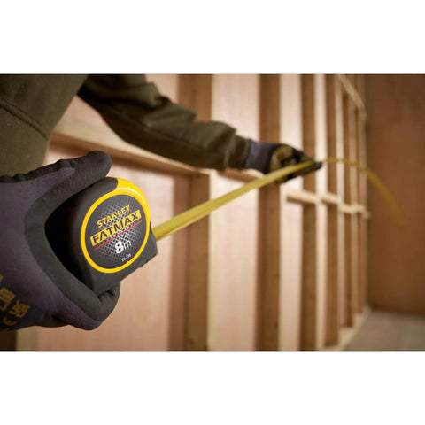 Tape Measure With Blade Armor Built Tough 8 M Metric being used, showing Shock Resistant, Mylar Coating, 32mm Wide Blade in construction.