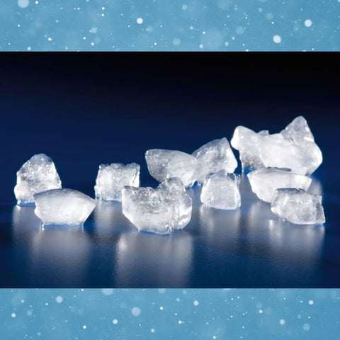 Countertop Nugget Ice Maker With Dispenser Churning Out Chewable Flake Ice On The Fly With Up To Three Hundred Fifty Pounds Daily Production Featuring Hassle Free Cleaning Panels For Your Bar Or Kitchen - Fresh nugget ice pieces on a dark surface.