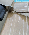 Close-up of HEMUNC oscillating multitool blade cutting cardboard; metal hook blade visible