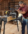 Boss Level Miter Saw Stand With Smooth Extension Rollers, 300 lb capacity, worker cutting wood with a miter saw on a sturdy frame.
