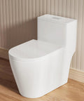 Slick Modern Elongated One Piece Toilet With Skirted Seamless Build And 17 Inch Comfort Chair Height Seat in bathroom setting.