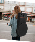 Person carrying a black Rock Solid Oxford Fabric Drum Storage Bag Hella Durable Percussion Pouch for travel.