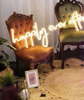 Happily Ever After Neon Sign LED Light for Weddings and Bridal Decor custom neon wall hanging with warm white glow on chairs.