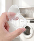 Hand holding Power Button Cover With Self Adhesive Backing And Clear Flip Lid Switch Protector That Keeps You From Accidental Button Taps