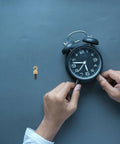 Hands holding black clock and Vintage Grandpa Clock Repair Weight Kit With Shell Hook And Nut Replacement Parts M5