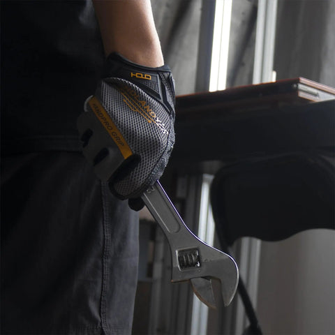 Grip-Ready Work Gloves For Men And Women With Touchscreen Compatibility, Medium Grey, holding a wrench indoors