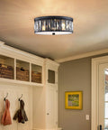 Crystal K9 Farmhouse Drum Semi Flush Mount Ceiling Light With Black Finish Dope Industrial Modern Chandelier 3 Light 12 Inch Fixture For Living Room Dining Room Kitchen Island Hallway installed in a cozy entryway with white cabinetry and hooks for coats.