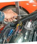 Mechanic installing Drift Ready Racing Car Oil Tank Hydraulic Reservoir Cup for brake and clutch control with tools on car engine.