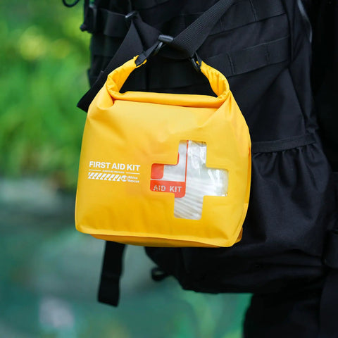 Yellow Waterproof Boat First Aid Kit with Lightweight Dry Bag for Kayak and Outdoor Adventures on backpack