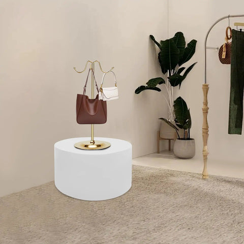 Heavy Duty 220 LB Capacity 20 Inch Round Mannequin Display Pedestal Stand In White For Retail Store Visual Merchandising And Shop Window Presentation Of Apparel Or Accessories With Iron Base with handbags on display.