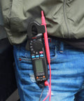 Technician carrying Pro Grade 1mA Resolution DC Clamp Meter True RMS Digital Multimeter With 6000 Counts Auto-Ranging tool.