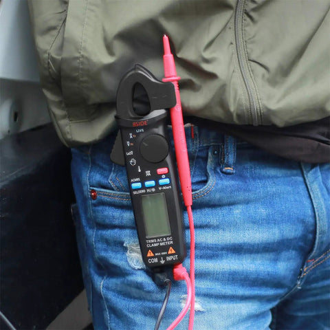Technician carrying Pro Grade 1mA Resolution DC Clamp Meter True RMS Digital Multimeter With 6000 Counts Auto-Ranging tool.