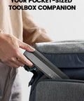Person placing Mini Electric Screwdriver Set With 60 Precision Bits And Four Torque Settings Magnetic Case Repair Tool Kit into a bag