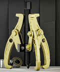 Shop Ready Heavy Duty Adjustable Bearing Puller Tool Forged From Tough Carbon Steel With Secure Handle Knocks Loose Stubborn Bushings And Gears Without Breaking A Sweat, showing gold claws and threaded shaft.