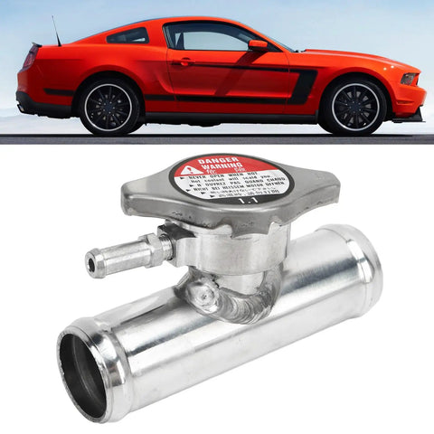 Must Have Inline Aluminum Radiator Hose Filler Neck Cap 32mm 1 And A Quarter Inch 16 PSI Durable Alloy Coolant Fitting shown in front of red car