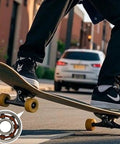 Person using skateboard equipped with 100 Pack 608 Ball Bearings High Precision Deep Groove Bearings on street