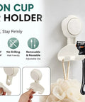 Hassle Free Heavy Duty Suction Cup Razor Holders For Bathroom Sink Organizer showing a black razor and loofah hooks.