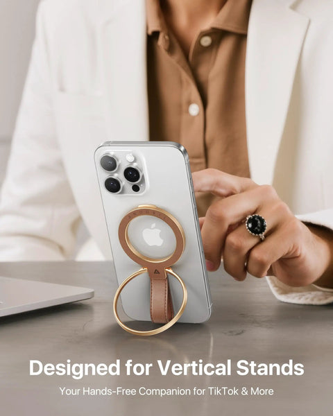 Premium Top Grain Leather MagSafe Phone Grip Holder with beefy metal kickstand attached to a smartphone for hands-free use.