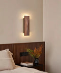 Feasey Set of 2 Walnut Wood Wall Sconce, Vintage Wall Mounted Light Fixture on beige wall above bedside table.