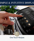 Close-up of a hand using the touch display on a Magnifica Evo Automatic Espresso And Coffee Machine With Built In Grinder And Auto Clean Function Manual Milk Frother Delivers Latte Cappuccino Americano And Iced Coffee With Five One Touch Drinks.
