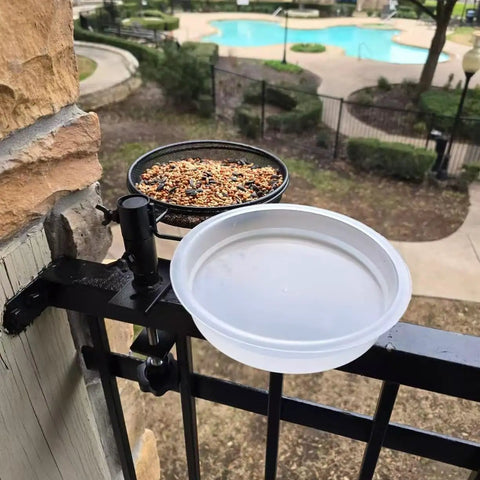 Two Pack Plastic Round Bird Feeder Bowls For Wild Birds Seed Tray And Water Bowl At Feeding Stations Easy To Clean Clear Water Visibility Attract Birds installed on a garden fence.