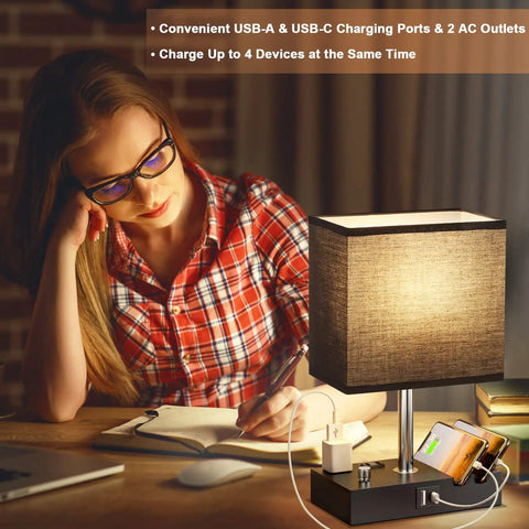 Woman using Dope Dual USB Dimmable Bedside Lamp With Phone Stand And Type C Charging Ports Black Desk Lamp For Nightstand